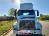 1999 Volvo  VNM64T300 6X4 T/A DAY CAB TRU