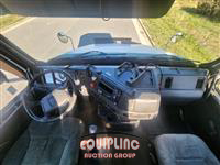 1999 Volvo  VNM64T300 6X4 T/A DAY CAB TRU