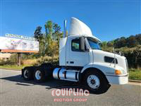 1999 Volvo  VNM64T300 6X4 T/A DAY CAB TRU