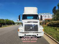 1999 Volvo  VNM64T300 6X4 T/A DAY CAB TRU