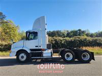 1999 Volvo  VNM64T300 6X4 T/A DAY CAB TRU